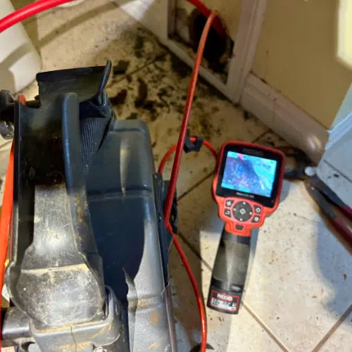 Drain inspection camera and monitor during a Sandy drain-cleaning job