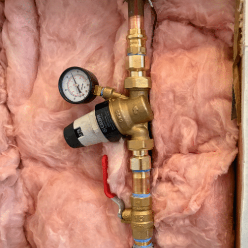 Pressure gauge verifying a new West Jordan pressure-reducing valve