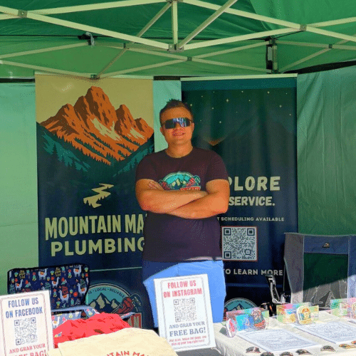 Tyler Nerdin at a Mountain Man Plumbing community booth