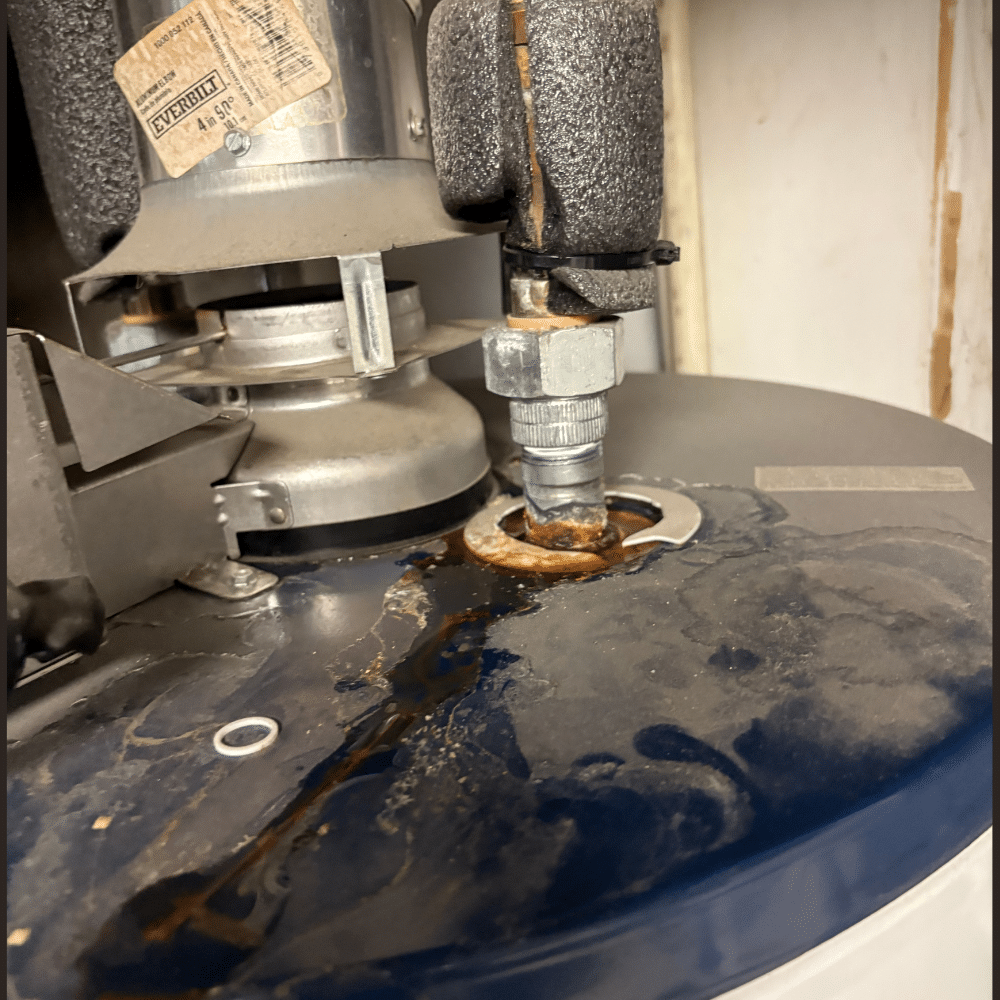 Corrosion and water staining at the top connection of a Sugar House water heater