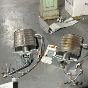 Failed gas burner assemblies pulled from Utah water heaters — a cost driver on older unit repairs