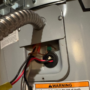 Wiring junction on a water heater during a Wasatch Front diagnostic — diagnostic time is part of every honest repair price
